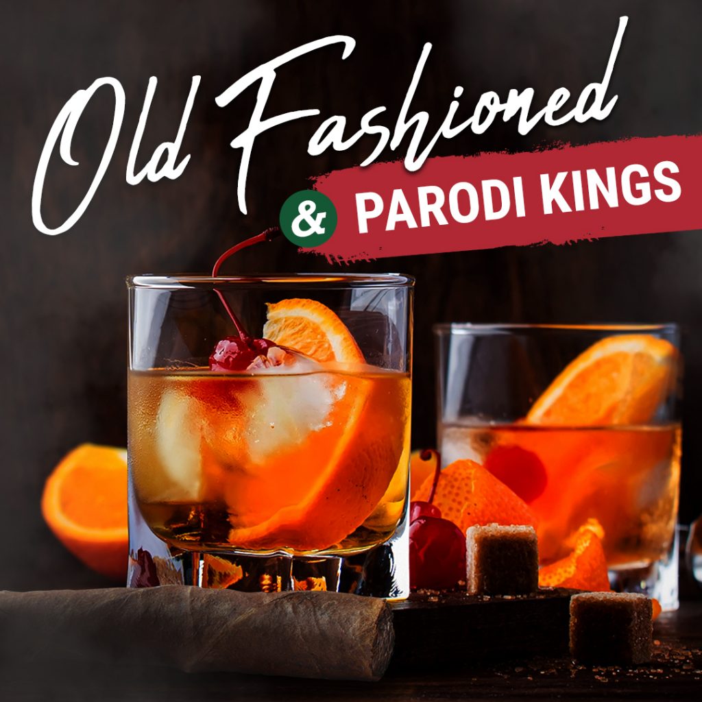 An old fashioned cocktail in a glass next to a Parodi Kings cigar