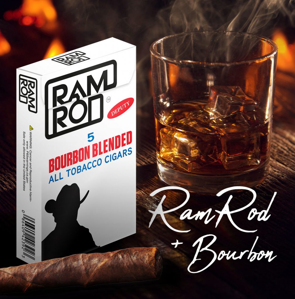 A box of avanti ramrod cigars and a single ramrod cigar on a table next to a glass of bourbon